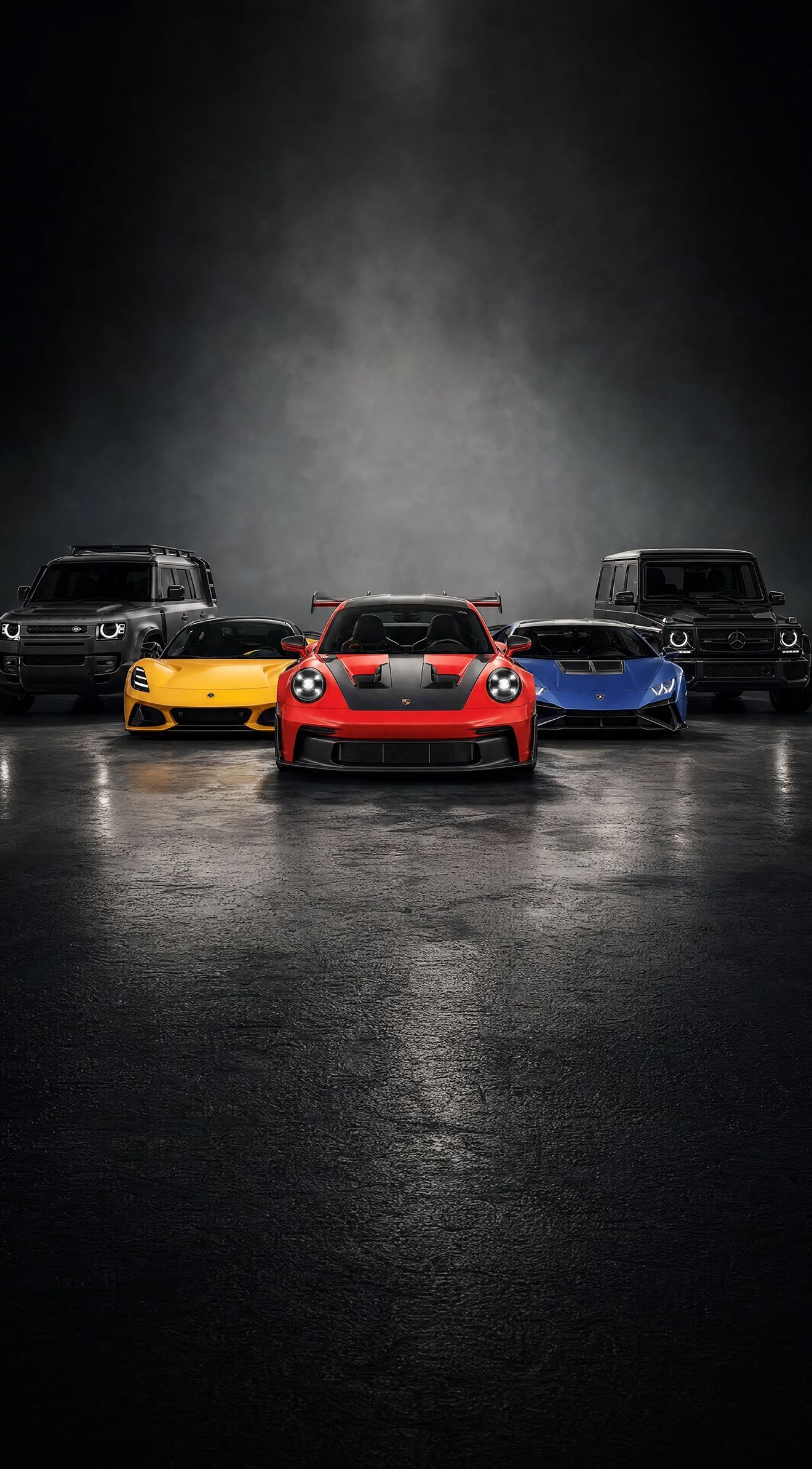 A custom Forge Porsche 911 GT3, Lamborghini Huracán, Lotus Emira, Land Rover Defender, and Mercedes G-Wagen parked on a wet surface.