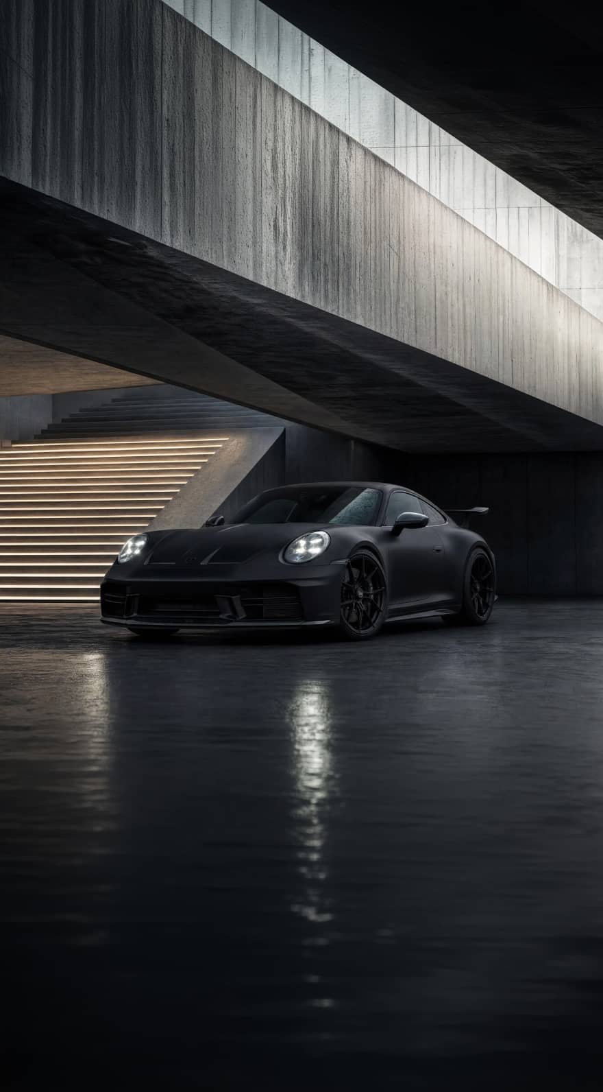 A custom Forge Porsche 911 Carrera Turbo with illuminated headlights parked on a wet concrete floor in a modern brutalist building with glowing stairs.